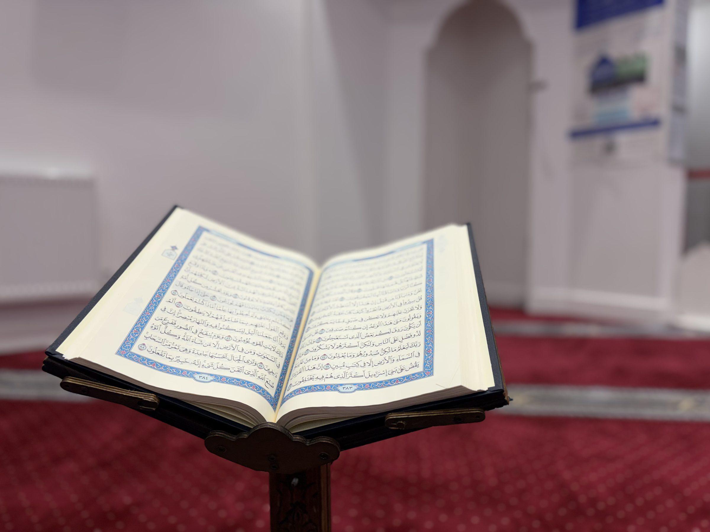 Open Qur'an on a wooden rehal — Masjid Ezzeitouna